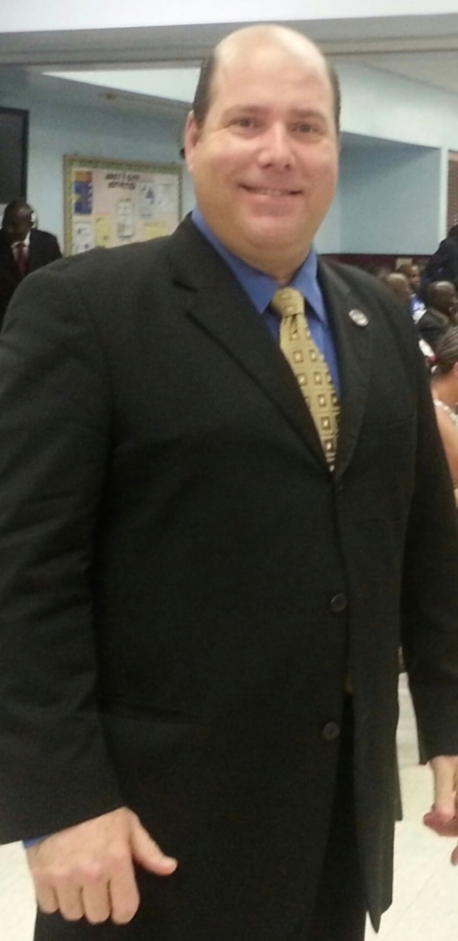 Joe before weight loss at 285 pounds in a dark suit